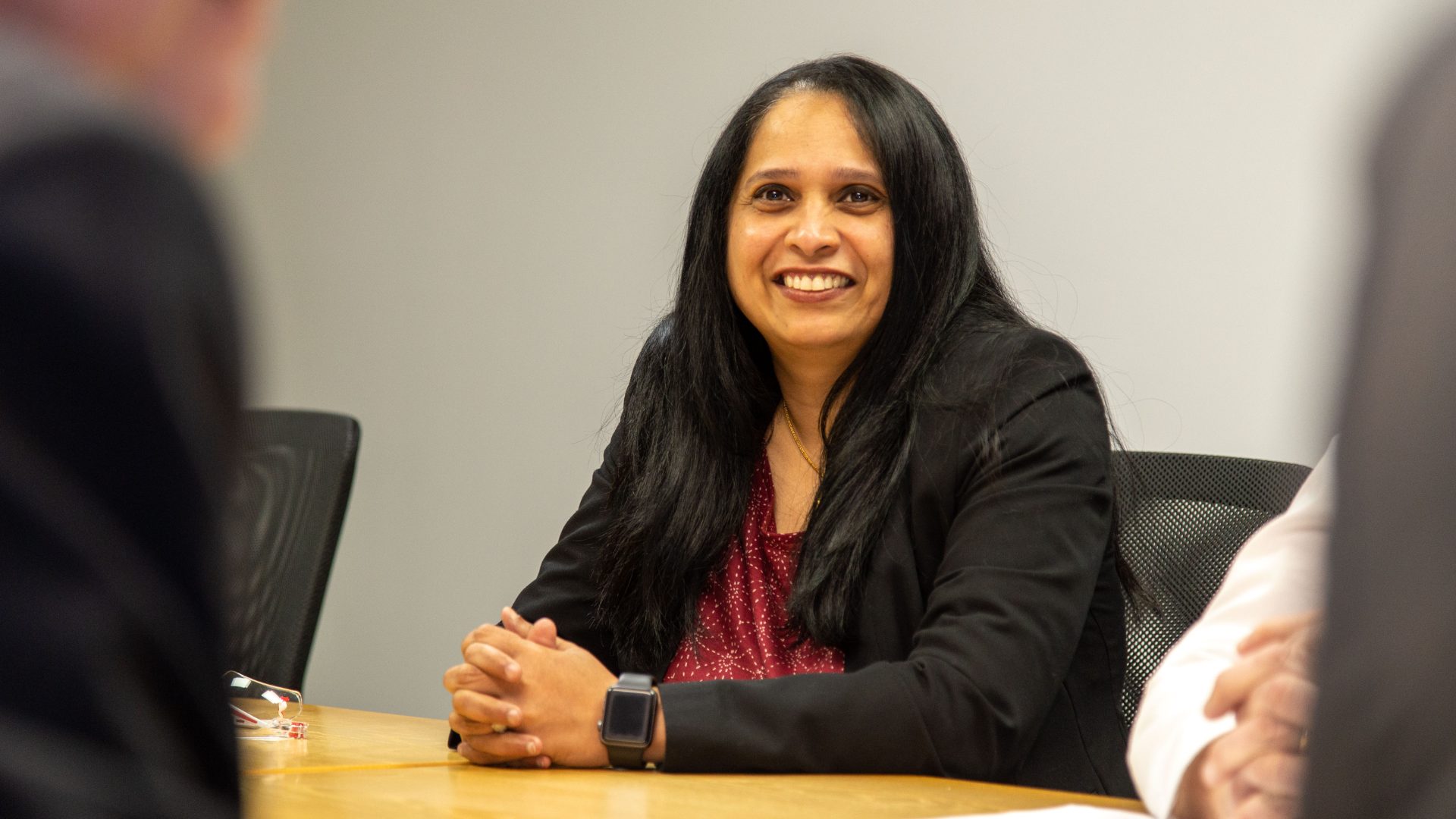 McMenon colleague taking part in a workplace discussion