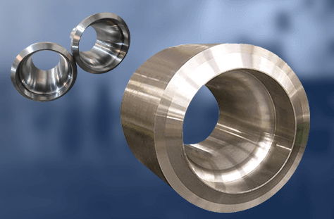 Three precision-machined metal flow nozzles of varying sizes