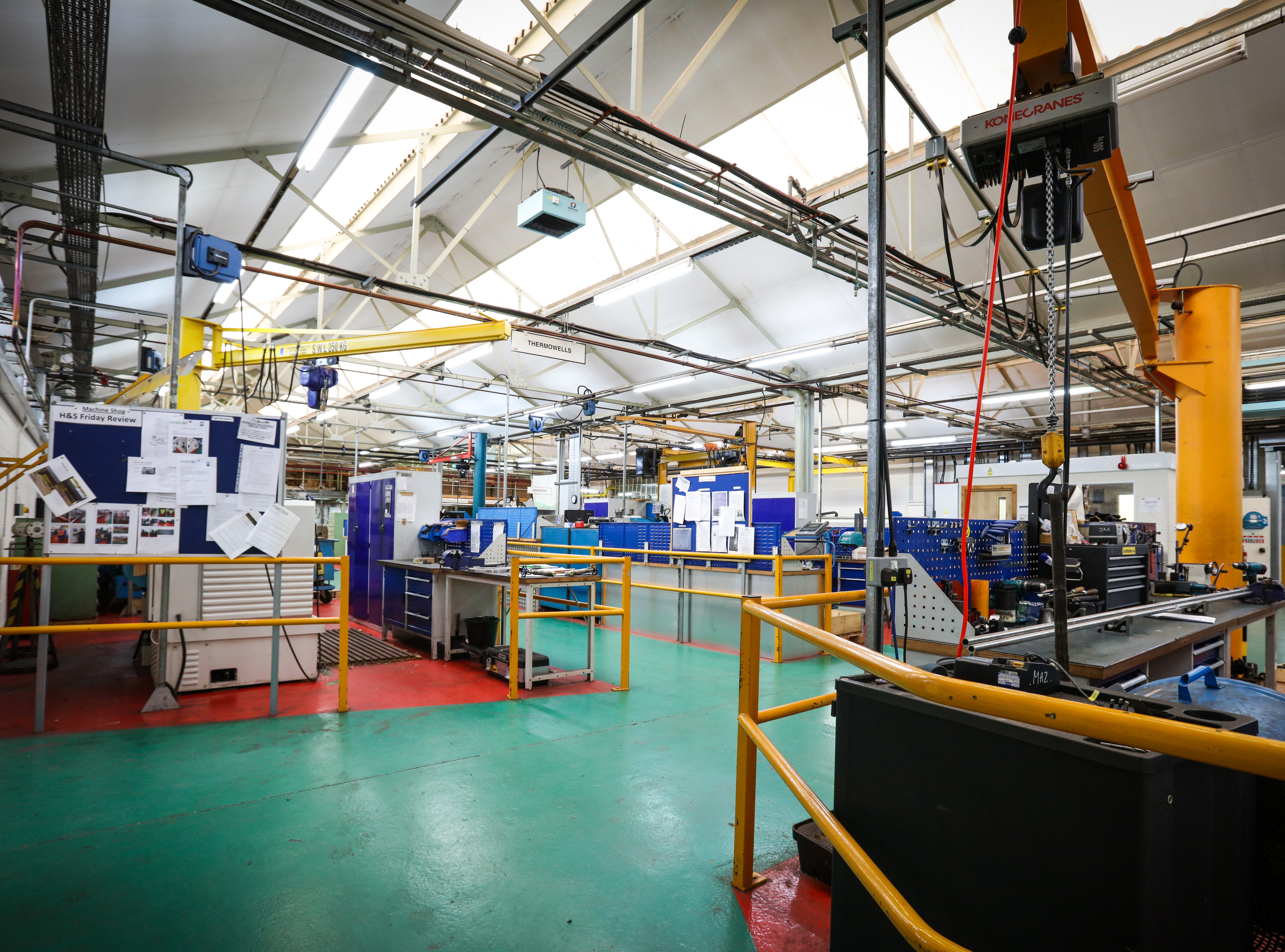 McMenon team member working in the machine shop