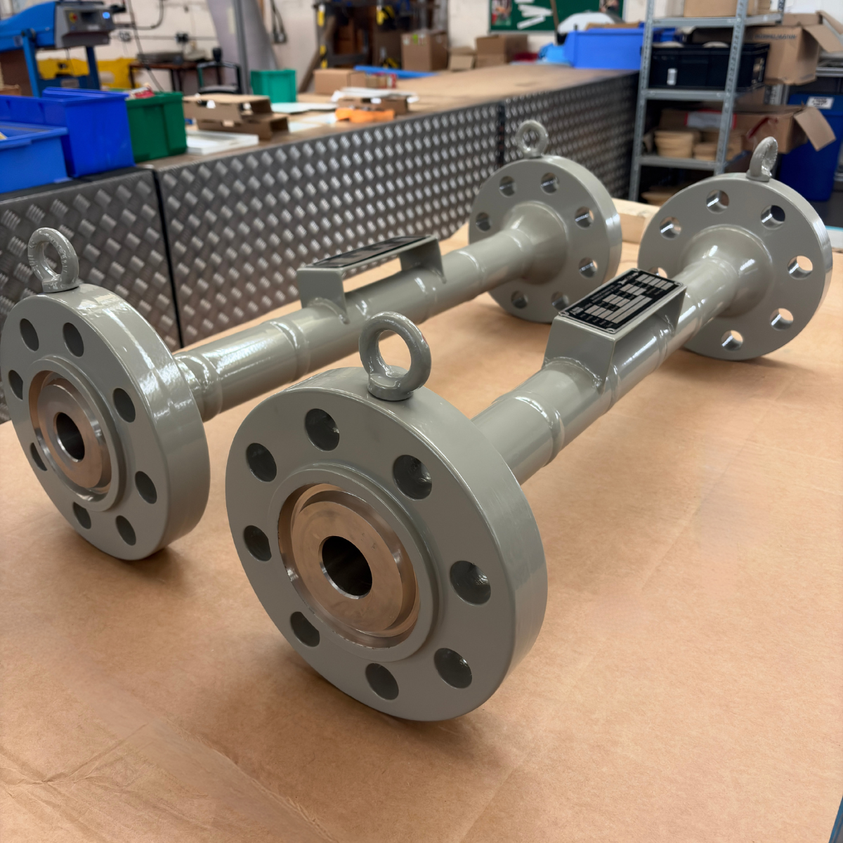 Multi-stage restriction orifice assemblies prepared for an offshore oil field expansion