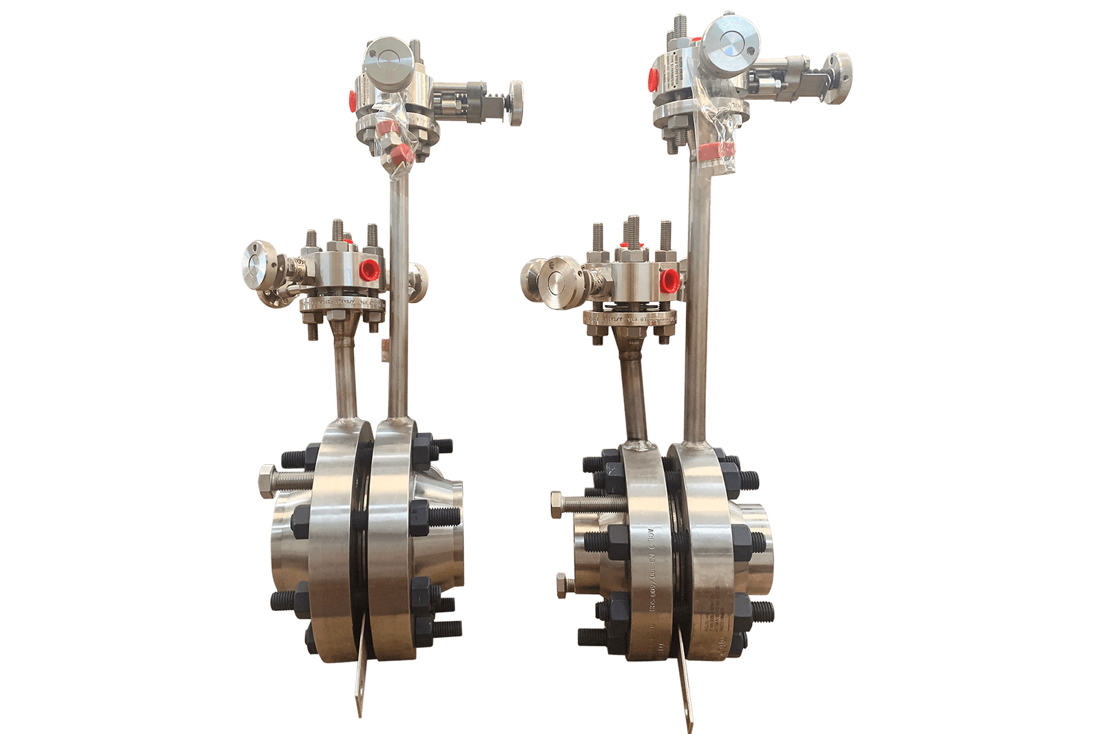 Two stainless steel orifice plate assemblies with bolted pipe flanges and mounted measurement instruments