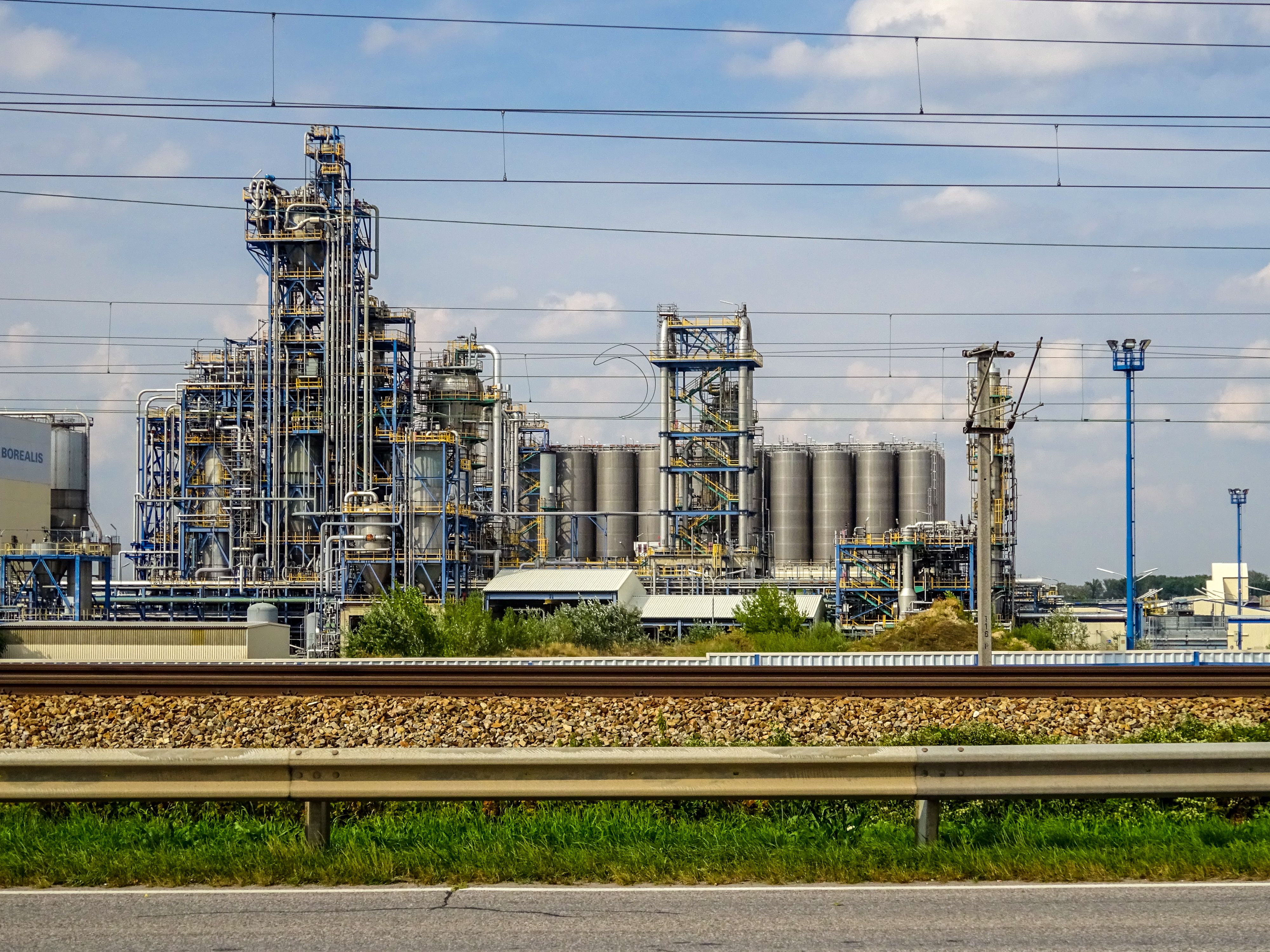 Chemical processing plant with industrial pipework and towers