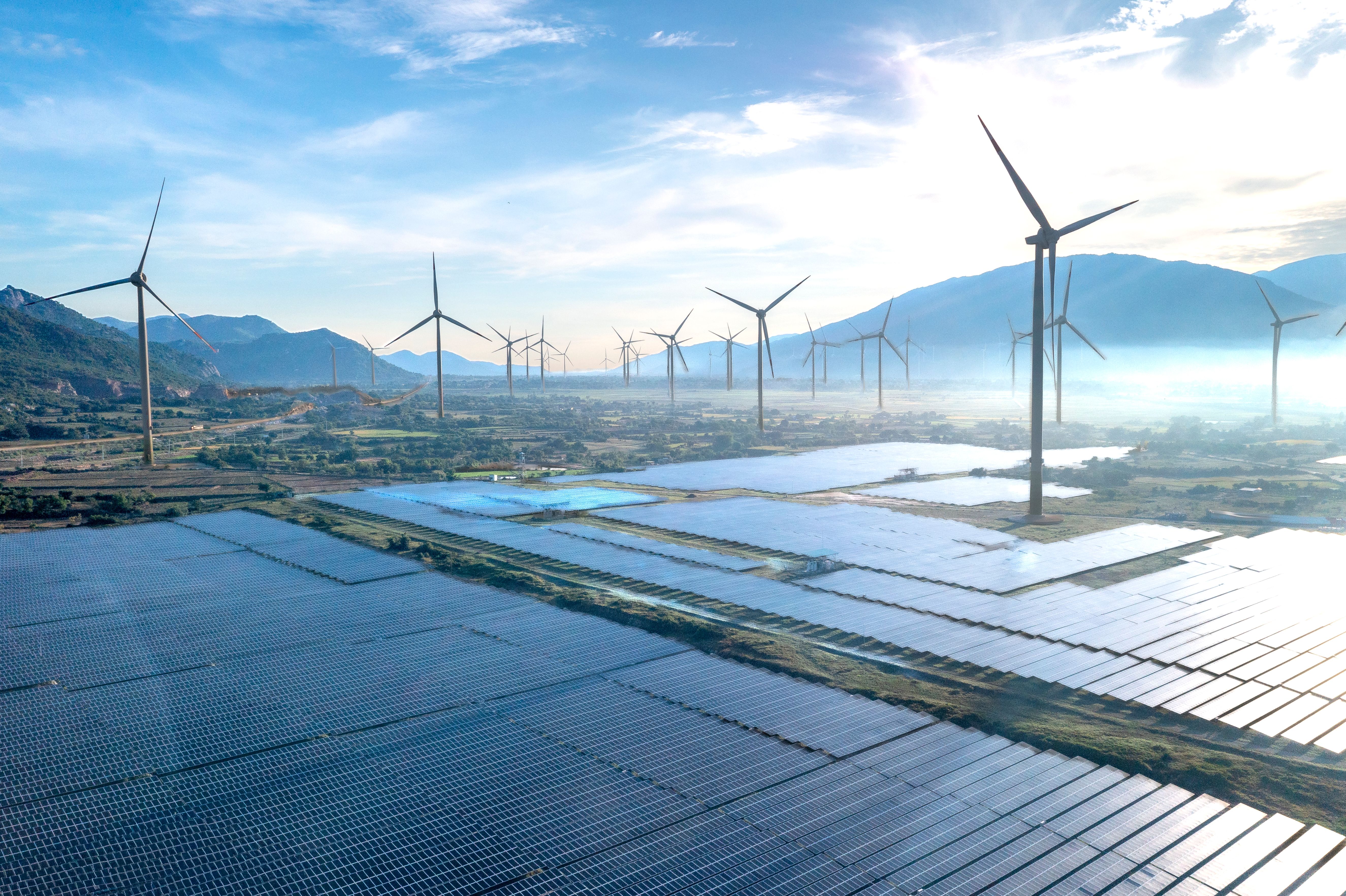 Wind turbines and solar panels at a renewable energy installation